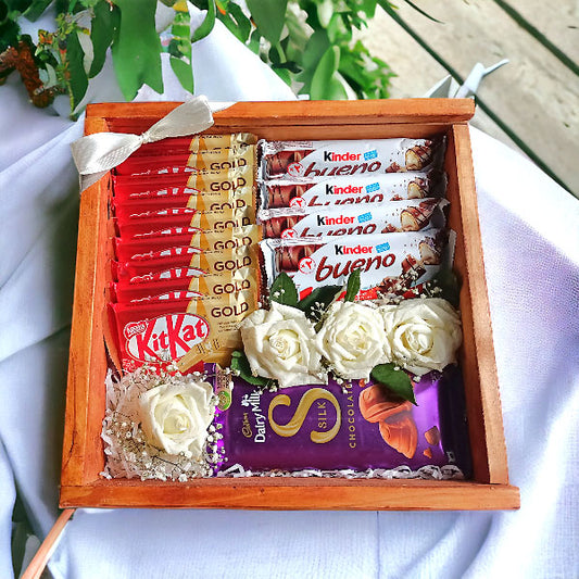 Assorted Chocolates and White Roses in a Wooden Box